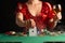 Girl in evening dress plays poker draws a card in a casino. focus on the card and focus