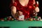 Girl in evening dress plays poker draws a card in a casino. focus on the card and focus