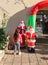 A girl examines large Santa Claus dolls on Sderot Ben Gurion Street in the Haifa city in northern Israel