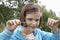 Girl Examining Caterpillar On Grass