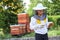Girl examining honeycomb at apiary garden