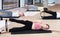 Girl exercising with flexible ring during group pilates class