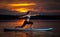 Girl exercising yoga on paddleboard in the sunset on scenic lake Velke Darko