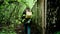 A girl explores an old concrete fence in the thicket