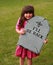 Girl with fake tombstone