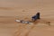 Girl falling from her sand board