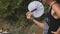 Girl is fanning herself on a hot day with a white fan