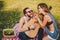 Girl feeding apple to her boyfriend on a picnic