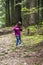 A girl feeding a carpathian squirell in the forest, Skole Beskids National Nature Park, Ukraine