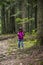 A girl feeding a carpathian squirell in the forest, Skole Beskids National Nature Park, Ukraine