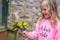 Girl feeding colourful Parrot Rainbow Lorikeets