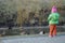 Girl feeding duck on river