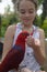 Girl feeding a parrot