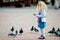 Girl feeding pigeons