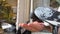 Girl feeds a pigeon that sits on her hand on a sunny autumn day