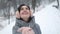 Girl Feeling the Snowfall on Her Hand in Forest