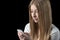 Girl feels depressed after reading bad sms on her mobile phone