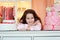 Girl at the festive table, littered with a lot of sweet desserts, Confectionery