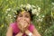 Girl in field flower garland