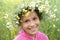 Girl in field flower garland