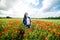 Girl in a field of poppies