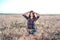 Girl in a field shirt shorts, wheat outdoor recreation, beautiful hair. Corrects hair.