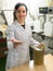 Girl filling bottles with olive oil