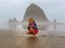 Girl Finds Jellyfish on Beach Cannon Beach Oregon