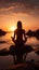 A girl finds serenity practicing yoga on the beach during a tranquil sunrise