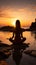A girl finds serenity practicing yoga on the beach during a tranquil sunrise
