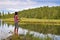 Girl fishing in lake