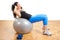 Girl fitness exercising on a ball