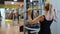 Girl in a fitness studio - daily training for a perfect body