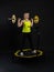 Girl on a fitness trampoline on a black background in a yellow t-shirt trampoline energy active activity caucasian