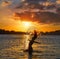 Girl flipping hair flip at sunset beach