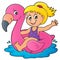 Girl floating on inflatable flamingo 1