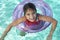 Girl Floating On Inflatable Raft In swimming Pool