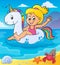 Girl floating on inflatable unicorn 2