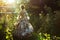 girl in a floral victorian gown walking through a sunlit garden