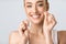 Girl Flossing And Cleaning White Teeth Posing In Studio, Cropped