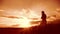 Girl folded her hands in prayer lifestyle silhouette at sunset. woman praying on her knees. slow motion video. Girl