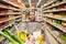 Girl with food in shopping cart at grocery store