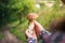 Girl found beautiful big mushroom - boletus edulis.