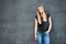 Girl in front of concrete wall