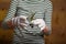 Girl in gardener gloves holding a succulent seedling. Spring time planting of indoor flowers