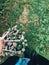 Girl gathering beautiful daisy flowers in canvas bag in cold autumn morning. Tranquil moment. Atmospheric morning. Flowers in bag