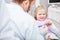 Girl gets tips to brush teeth