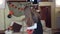 Girl getting ready to celebrate Halloween, holding a paper garland with pumpkins to decorate the house