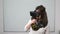 Girl getting scared while playing a virtual reality video game with VR glasses during a test session in classroom