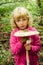 Girl with giant parasol mushroom